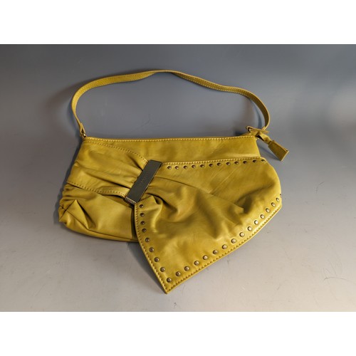 559 - Fiorelli handbag in mustard yellow leather, appears unused 29 x 19cm