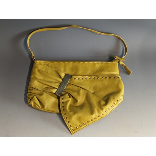 559 - Fiorelli handbag in mustard yellow leather, appears unused 29 x 19cm