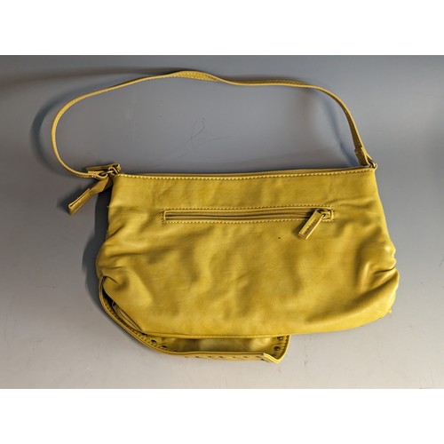 559 - Fiorelli handbag in mustard yellow leather, appears unused 29 x 19cm