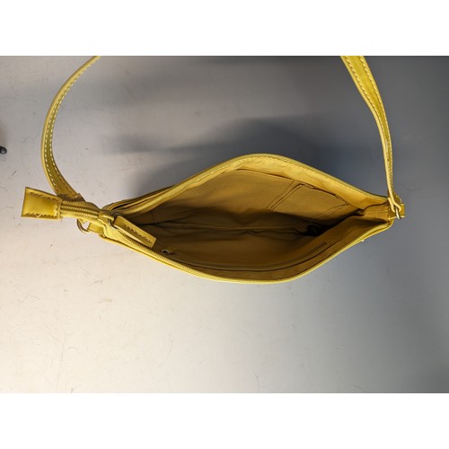 559 - Fiorelli handbag in mustard yellow leather, appears unused 29 x 19cm