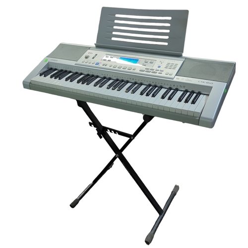 563 - Casio CTK-810 keyboard on stand.