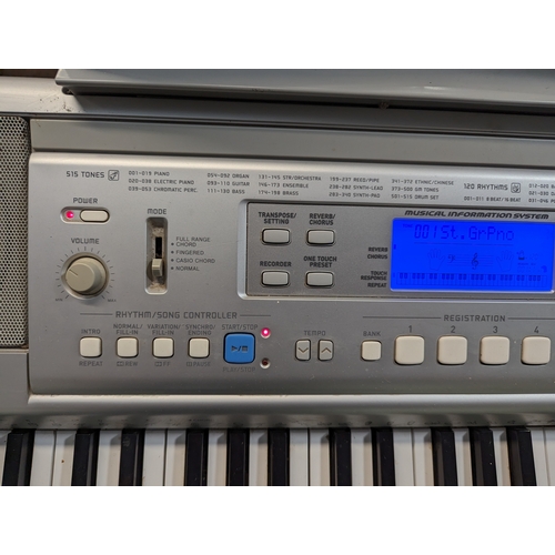 563 - Casio CTK-810 keyboard on stand.