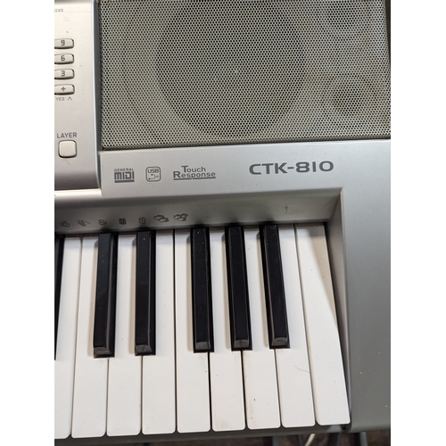 563 - Casio CTK-810 keyboard on stand.