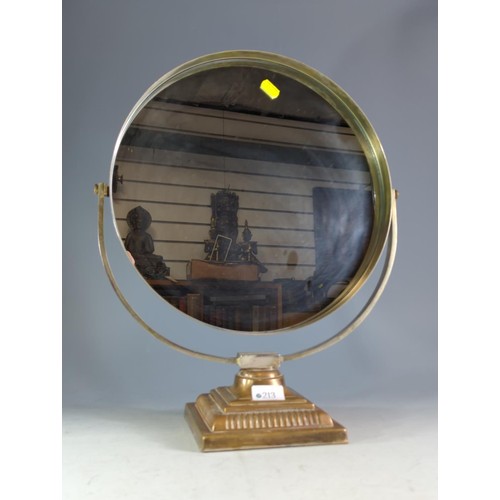 213 - Circular dressing table mirror mounted on a brass stand.Mirror diameter 35.5 cms, full ht 48 cms... 