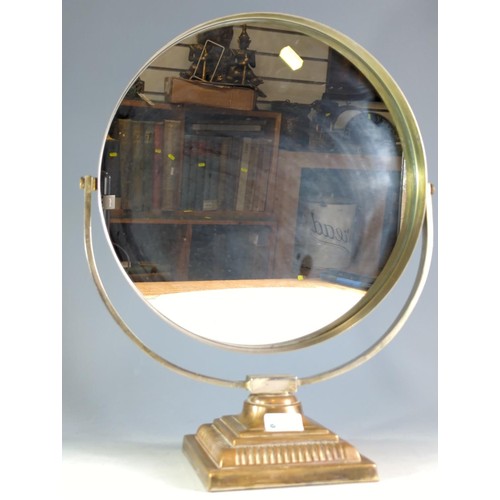 213 - Circular dressing table mirror mounted on a brass stand.Mirror diameter 35.5 cms, full ht 48 cms... 