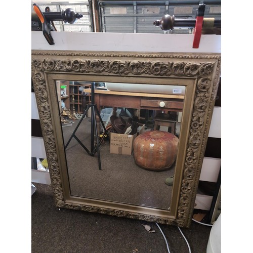 107 - Early C20th ornately carved wood framed mirror, pine backed, 92 x 105cm