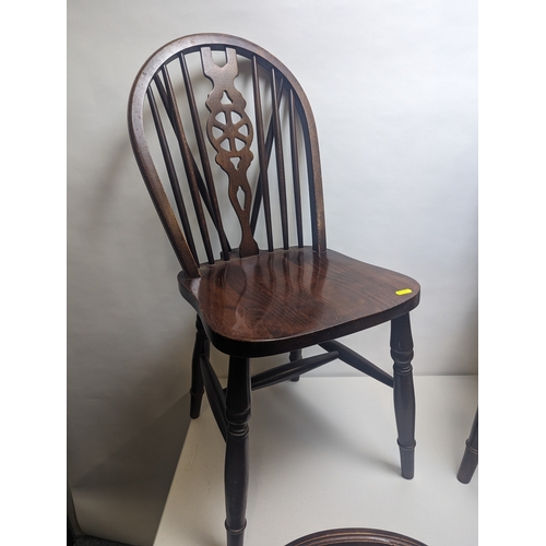 47 - 4 x Wheelback dining chairs