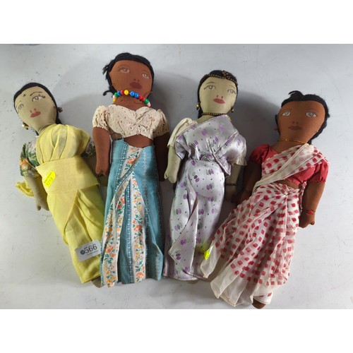 566 - Four vintage Sri Lankan cloth dolls, height 33cm