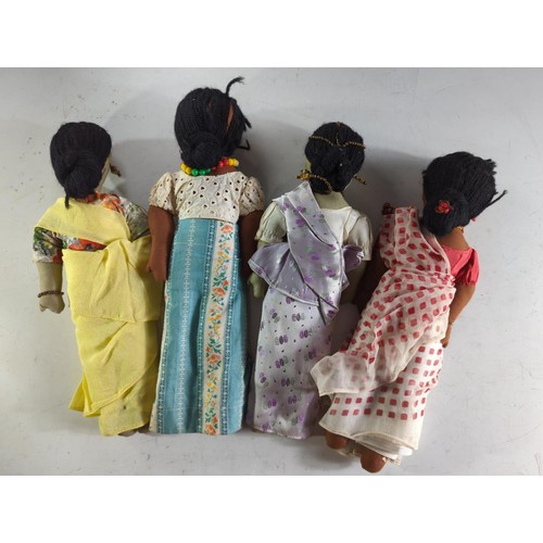 566 - Four vintage Sri Lankan cloth dolls, height 33cm