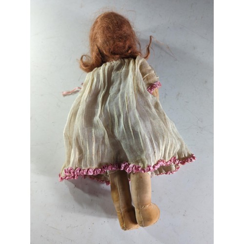 568 - Early C20 doll with ginger hair