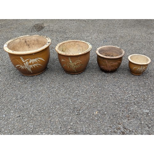 14 - Four graduated glazed planters, largest dia. 39 x ht.26cm