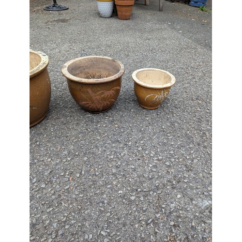 14 - Four graduated glazed planters, largest dia. 39 x ht.26cm