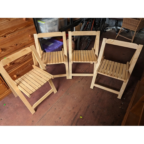 167 - 4 folding light wood chairs