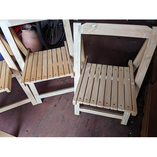 167 - 4 folding light wood chairs