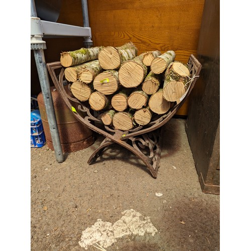 146 - Cast iron log basket and logs 