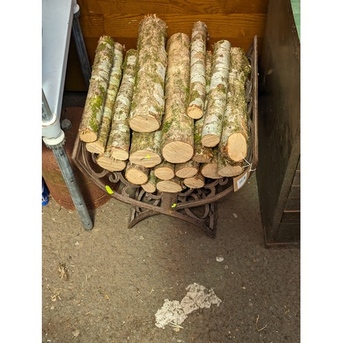 146 - Cast iron log basket and logs 