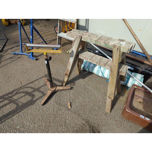 107D - Pair of wooden trestles plus metal roller on stand