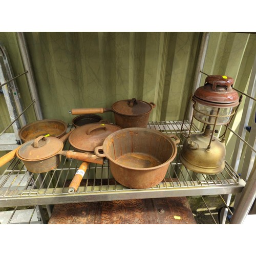 28 - Six cast iron cooking vessels, some with lids