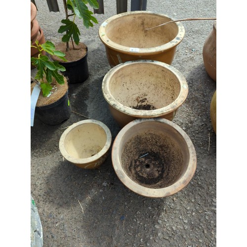 2 - 4 graduated glazed pots largest dia 39cm