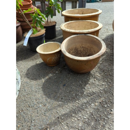 2 - 4 graduated glazed pots largest dia 39cm