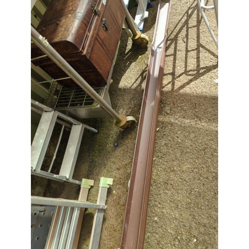 30 - Quantity of brown plastic guttering. Longest approx. 250cm