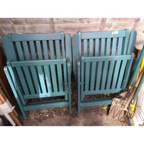 68 - Two green painted fold up wooden garden chairs