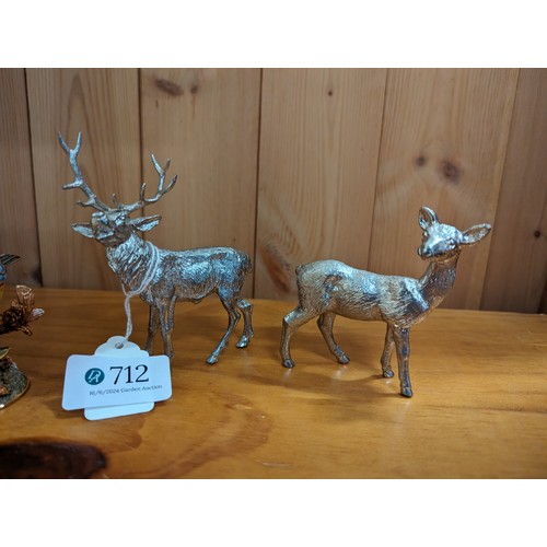 712 - Three white metal animals: stag (ht. 10cm), doe and a wolf together with a Little Gems blue tit trin... 