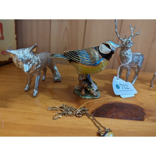 712 - Three white metal animals: stag (ht. 10cm), doe and a wolf together with a Little Gems blue tit trin... 