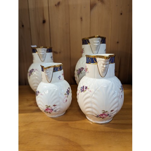 724 - Coalport, set of four graduated reproduction Caughley Mask-Head jugs, tallest 19cm