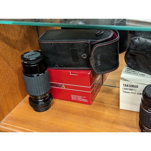 730 - Three shelves of cameras and accessories inc. Rollei 35 LED, Rollei A110, Konica, Pentax, Samsung et... 