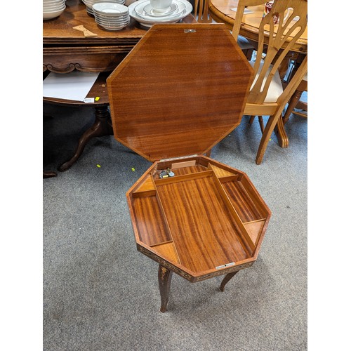 822 - Inlaid octagonal musical table, top 46 x 46, ht 51cms