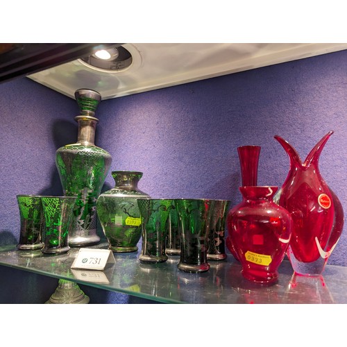 731 - Venetian green glass decanter, ht. 28cm vase and six glasses together with three red Murano vases