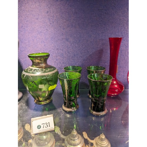 731 - Venetian green glass decanter, ht. 28cm vase and six glasses together with three red Murano vases