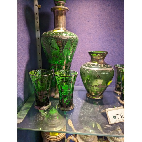 731 - Venetian green glass decanter, ht. 28cm vase and six glasses together with three red Murano vases