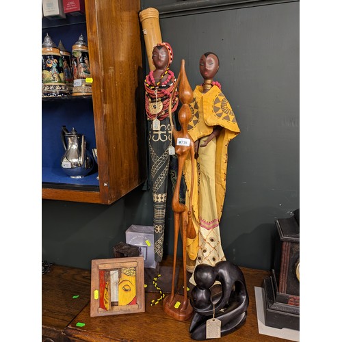 738 - Three tall carved African figures, soapstone sculpture, buddha candle holder, Aboriginal rain stick ... 