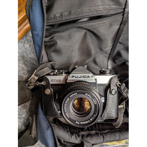 742 - Fujika STX-1 camera in bag with spare lens and other accessories