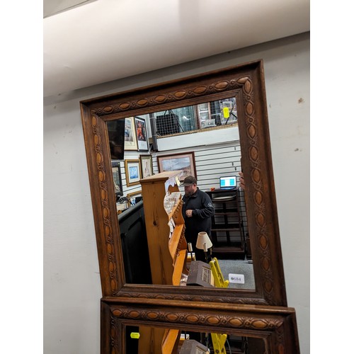 684 - Pair of carved oak framed mirrors 52 x 64cm