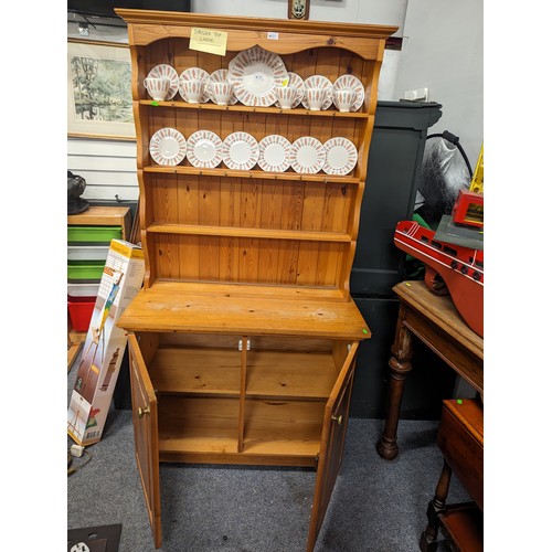 857 - Pine open-backed dresser with covered base, 97 x 43.5 x 183cms