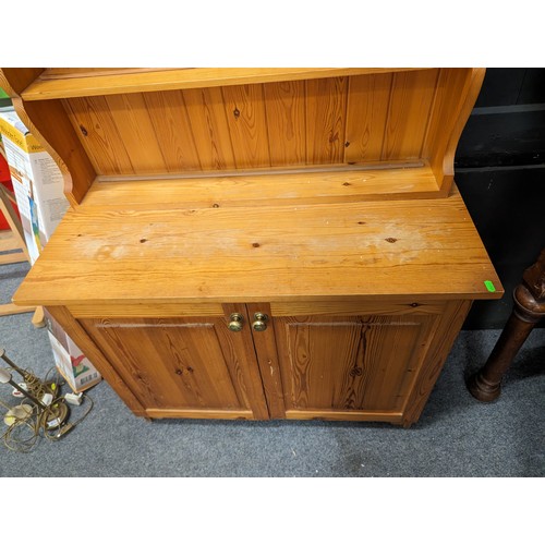 857 - Pine open-backed dresser with covered base, 97 x 43.5 x 183cms