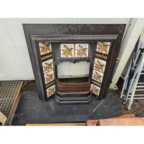 77 - Cast iron fireplace with tiled surround together with slate hearth 137 x 46cm, fireplace W92 x H97cm