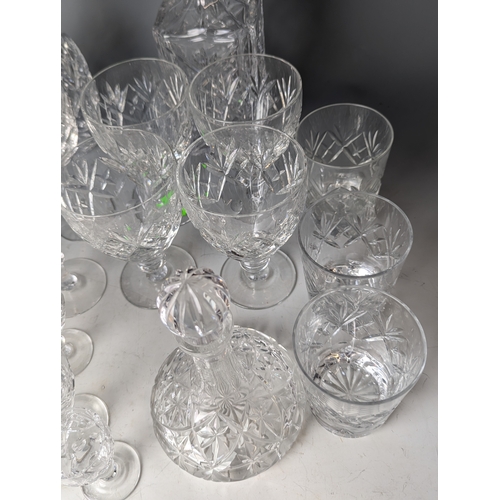 234 - Cut Glassware on shelf including decanters, tumblers ect