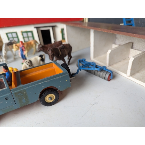 642 - Britains farm yard with animals buildings trees stables land rover l.w.b and other items. Including ... 