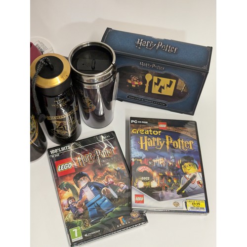 667 - Harry Potter misc. water bottles. 2 cauldron mugs. 2 drinking glasses. Xmas decorations. Lego PC gam... 