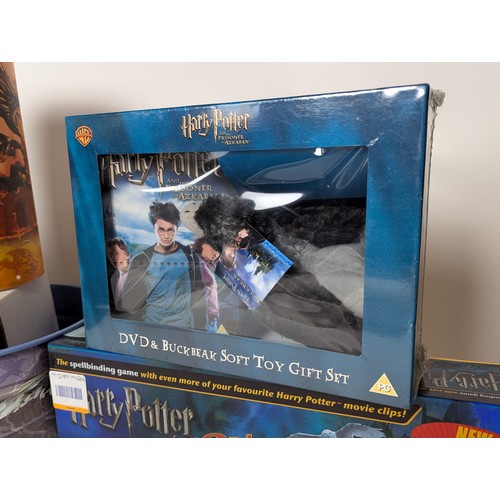 673 - Collection of Harry Potter items Inc VHS DVD'S, DVD game, lamp + 4 piece dinner set Etc