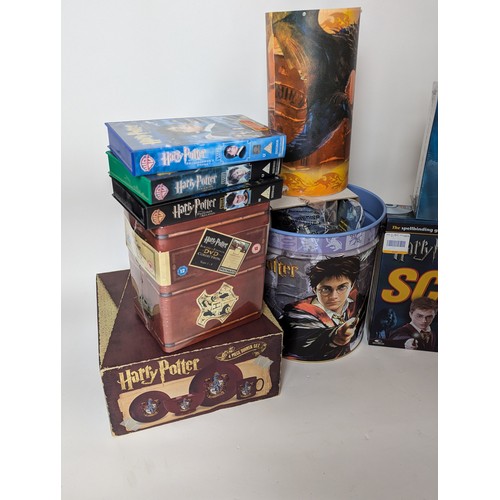 673 - Collection of Harry Potter items Inc VHS DVD'S, DVD game, lamp + 4 piece dinner set Etc