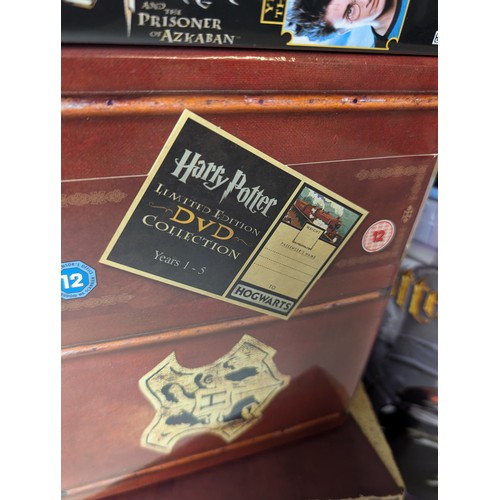 673 - Collection of Harry Potter items Inc VHS DVD'S, DVD game, lamp + 4 piece dinner set Etc