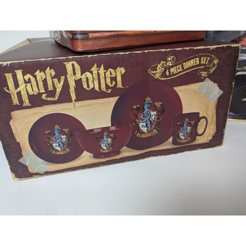 673 - Collection of Harry Potter items Inc VHS DVD'S, DVD game, lamp + 4 piece dinner set Etc