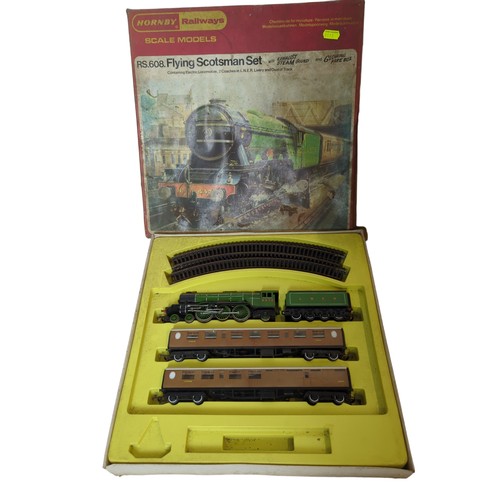 675 - Hornby RS.608. Flying Scotsman set boxed, yellow tub of spare track and accessories inc power supply... 