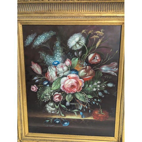 299 - Oil on board or a floral still life in an ornate gilt frame, unsigned, 62 x 71cm