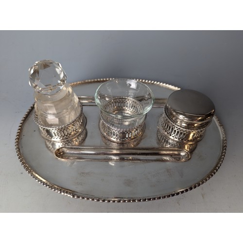 183 - Silver plated desk stand with three various glass pots